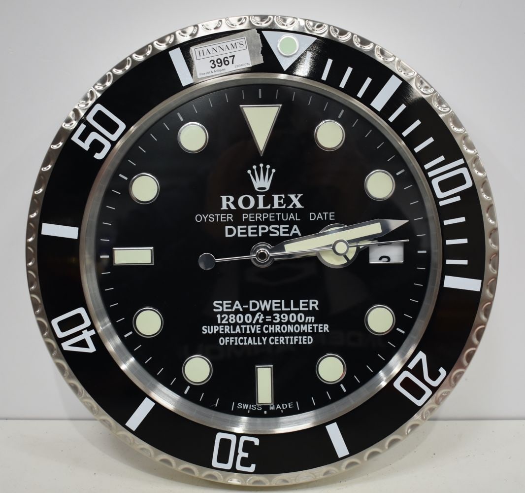 A Contemporary Rolex style dealership clock 33 cm.: A Contemporary Rolex style dealership clock 33 cm.