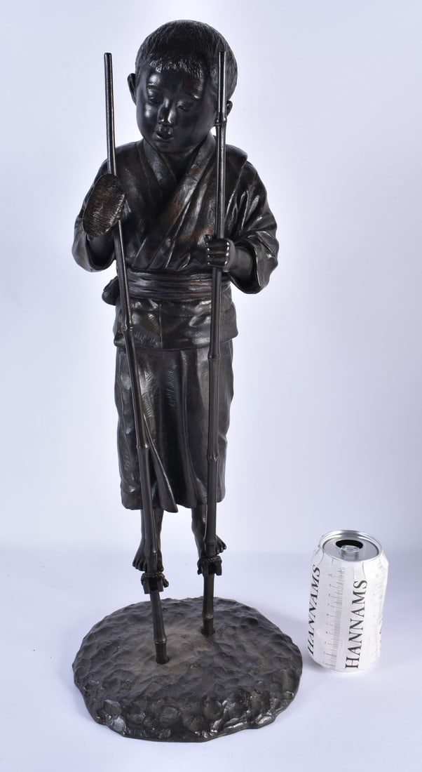A LARGE 19TH CENTURY JAPANESE MEIJI PERIOD BRONZE OKIMONO modelled as a young boy walking on stilts. (1 of 6)