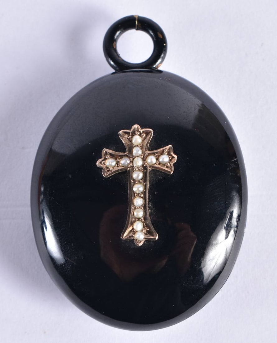 A Victorian Jet Mourning Locket set with a Gold Cross mounted with Pearls. 5.5cm x 3.7cm x 1.7cm, we (1 of 3)