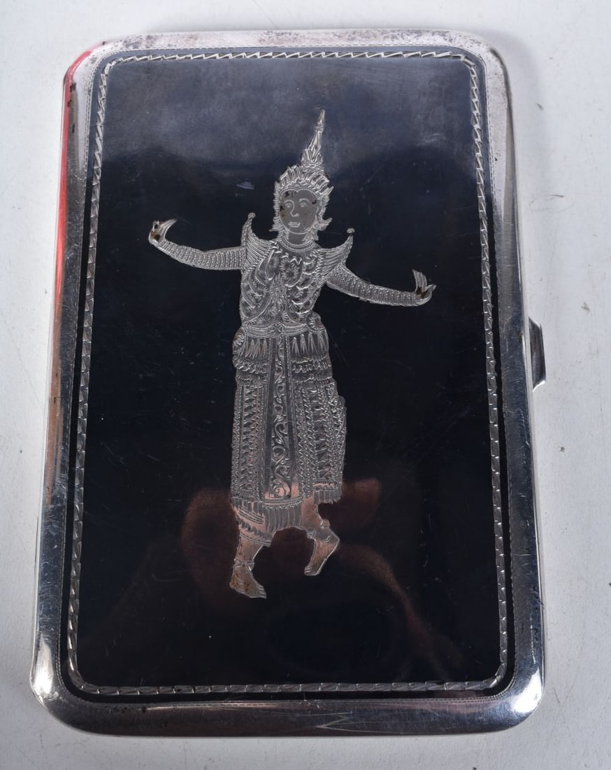 A Silver and Enamel Cigarette Case with a figure of a Siamese Dancer in Silver on the cover. Stampe: A Silver and Enamel Cigarette Case with a figure of a Siamese Dancer in Silver on the cover. Stamped Sterling.12.8cm x 8.4cm x 1cm, weight 149.5g