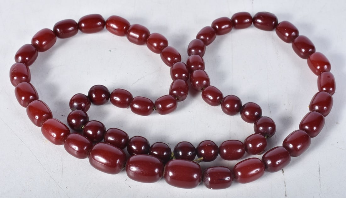 Cherry Bakelite graduated necklace. 83cm long, weight 90g, largest bead 15mm: Cherry Bakelite graduated necklace. 83cm long, weight 90g, largest bead 15mm