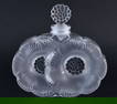 A FRENCH LALIQUE GLASS FLOWER SCENT BOTTLE. 9.25cm x 9.5 cm.