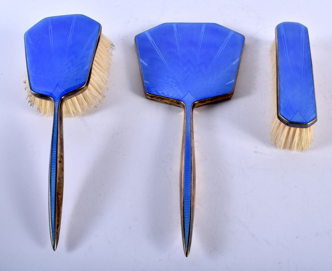 AN ART DECO SILVER AND ENAMEL DRESSING TABLE SET. 482 grams overall. Largest 28 cm x 12.5 cm. (3) (1 of 3)