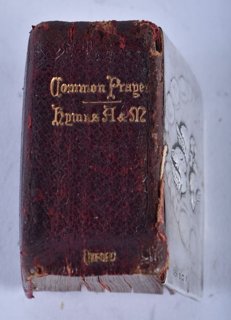The Bijou Prayer Book with Silver decorated religious scene (Mary, Jesus, the Apostles and Cherubs).: The Bijou Prayer Book with Silver decorated religious scene (Mary, Jesus, the Apostles and Cherubs). Hallmarked Birmingham 1904. 1.2cm x 5cm x 3.6cm, weight 16g