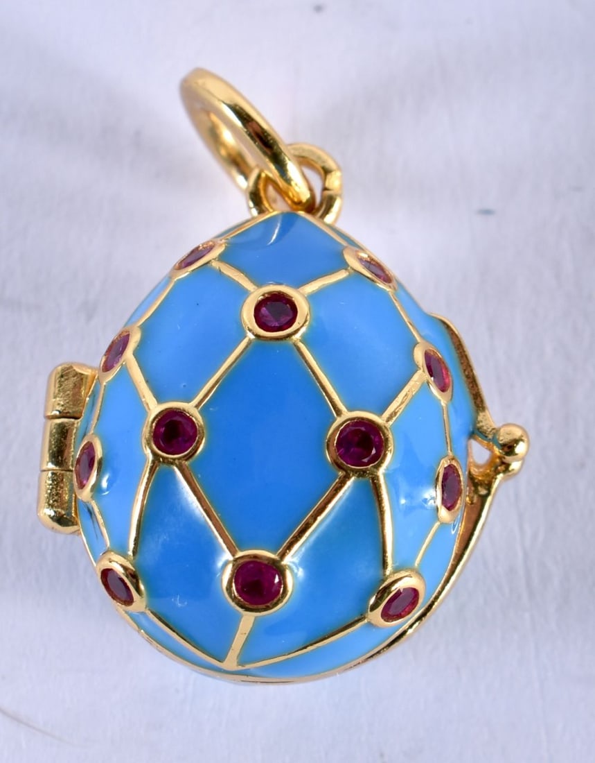 A CONTINENTAL SILVER AND ENAMEL EGG PENDANT. 6 grams. 2 cm x 1.5 cm. (1 of 3)
