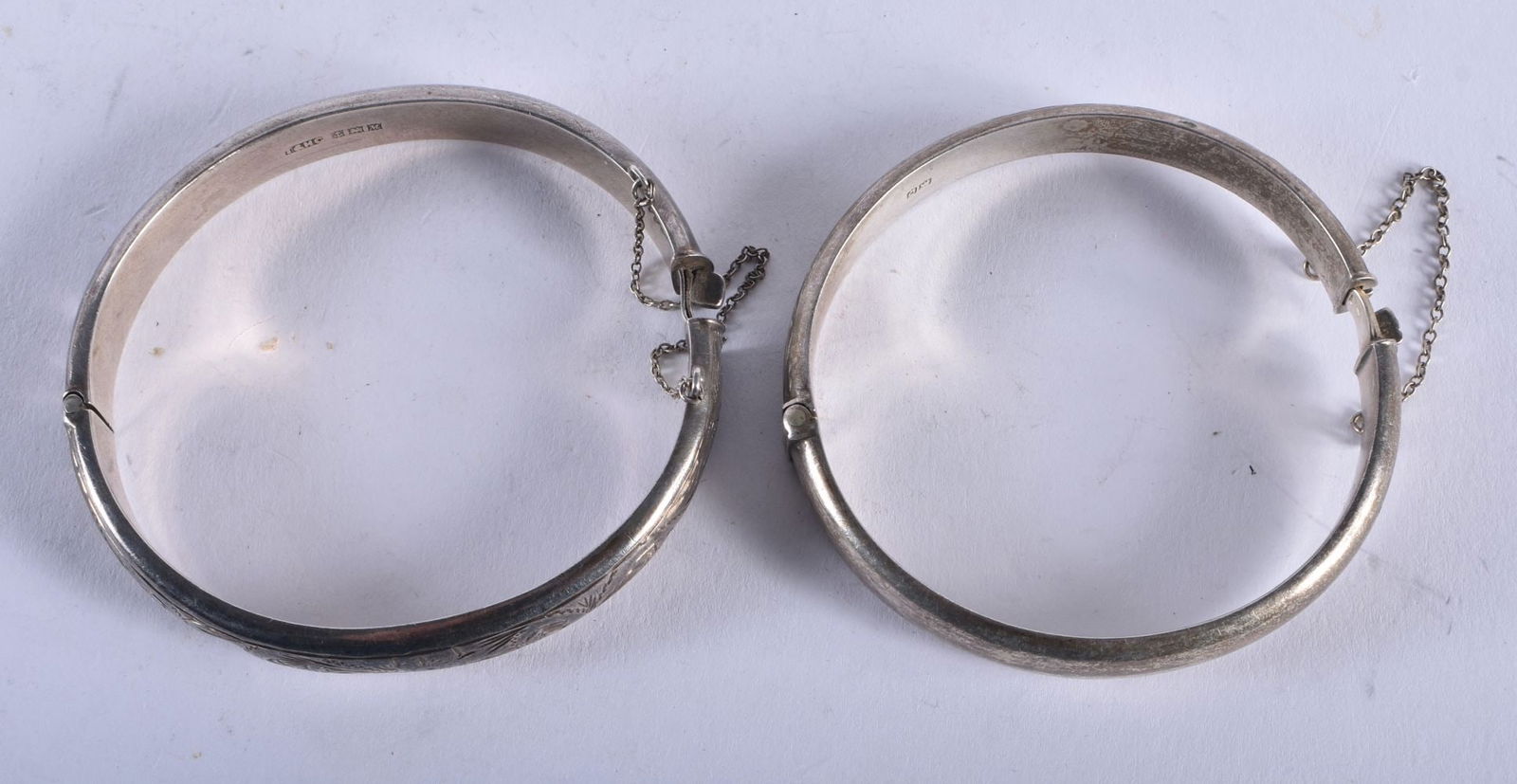 Two Bright Cut Silver Bracelets. Hallmarked Chester 1954 and 1961.? Largest Internal 5.8cm x 5.4cm.? (1 of 3)