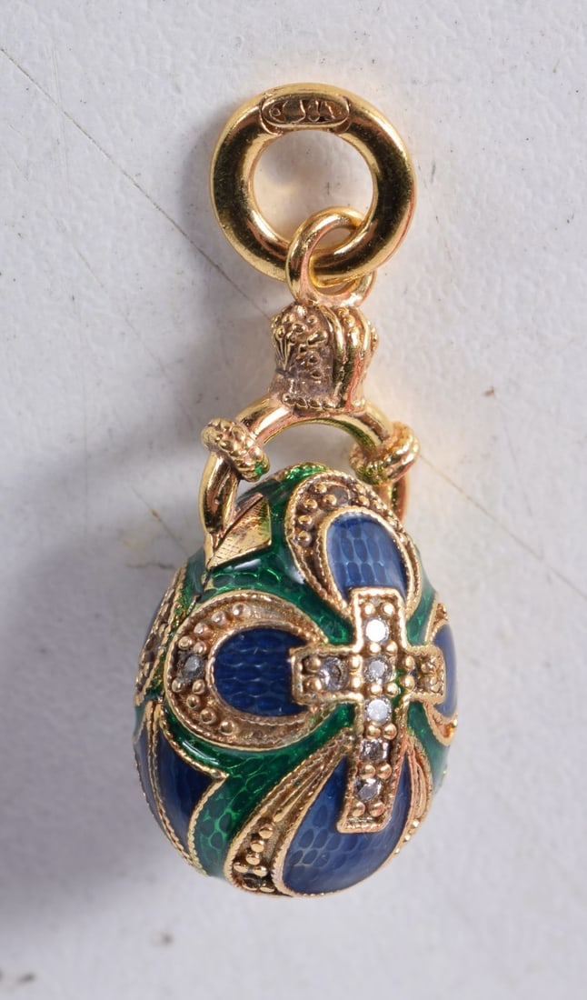 A Continental Silver Gilt and Enamel Egg Pendant. Stamped 84. 2.6cm x 1.2cm, weight 6.6g (1 of 3)
