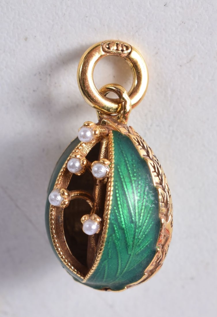 A Continental Silver and Green Enamel Egg Pendant. Stamped 84. 2.2cm x 1.4cm, weight 6.3g (1 of 3)