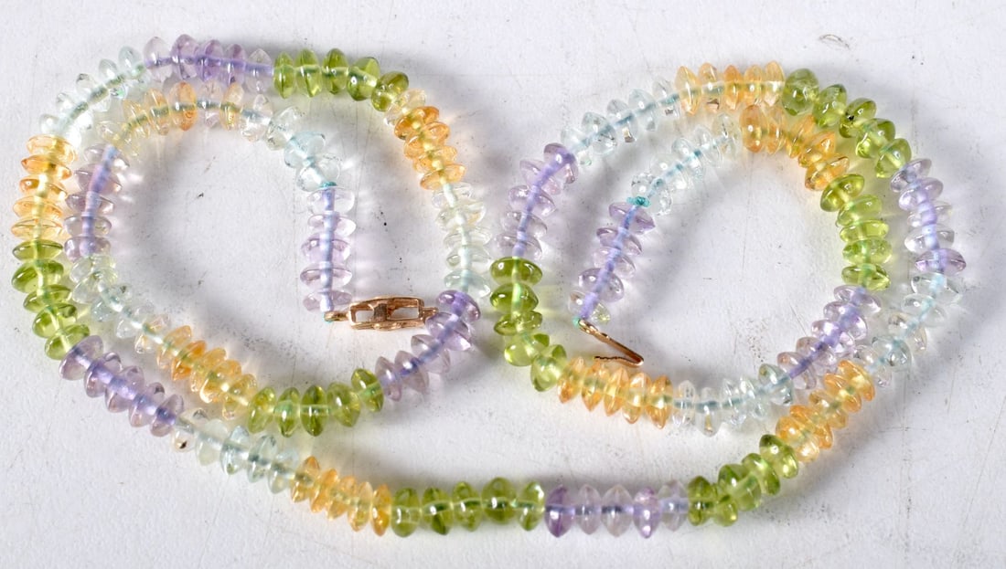 A 14CT GOLD GEM SET NECKLACE. 14.8 grams. 45cm long. (1 of 3)