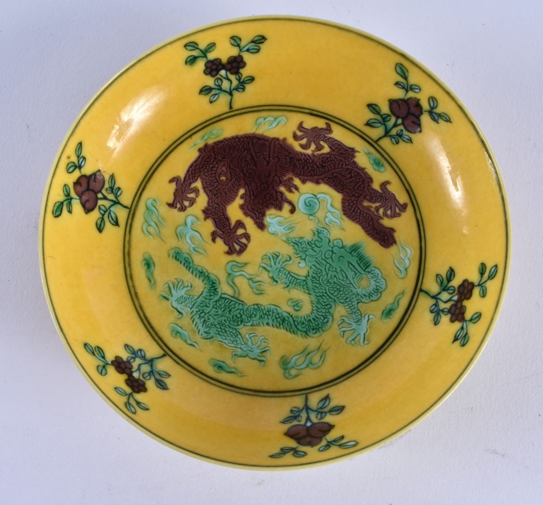 A CHINESE IMPERIAL YELLOW GLAZED DOUBLE DRAGON DISH 20th Century, bearing Guangxu marks to base. 10. (1 of 5)
