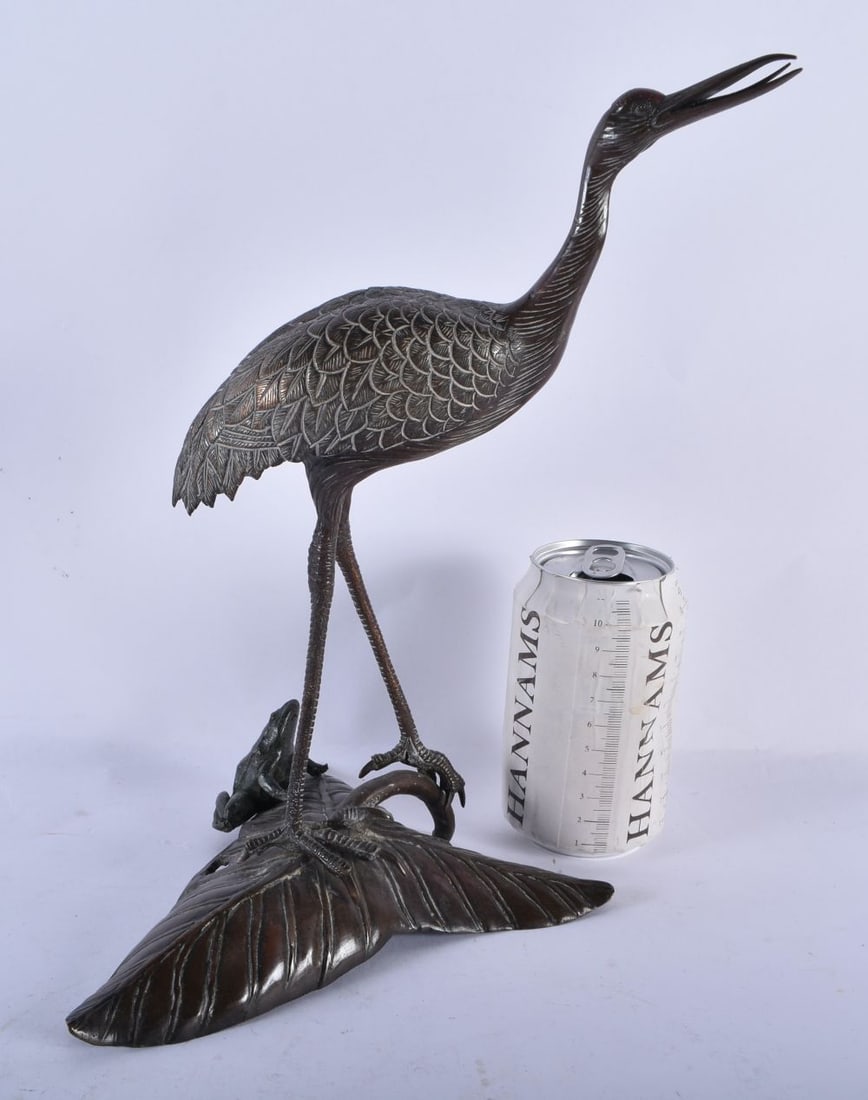 A LARGE 19TH CENTURY JAPANESE MEIJI PERIOD BRONZE OKIMONO modelled as a bird standing upon a leaf. 2: A LARGE 19TH CENTURY JAPANESE MEIJI PERIOD BRONZE OKIMONO modelled as a bird standing upon a leaf. 29 cm x 18 cm.