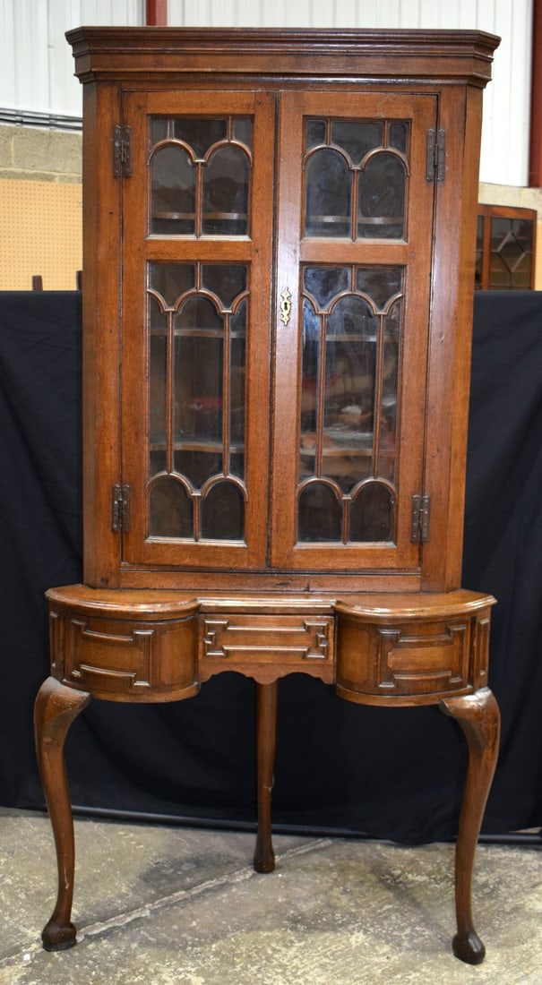 An Oak glazed door corner cabinet on a  stand with one central drawer and 2 front opening small side (1 of 6)