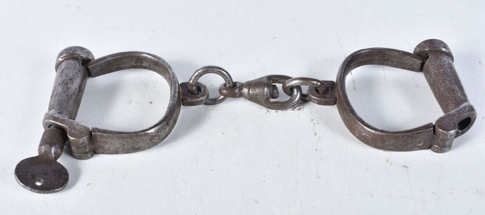 A pair of antique Hyatt handcuffs 8 x 23cm. (1 of 3)