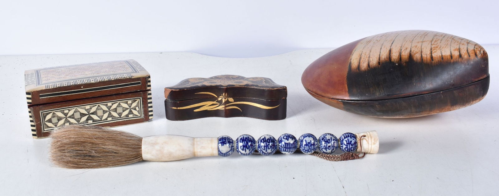 A Japanese lacquered wooden shell box together with a Chinese artists brush with a porcelain handle, (1 of 11)