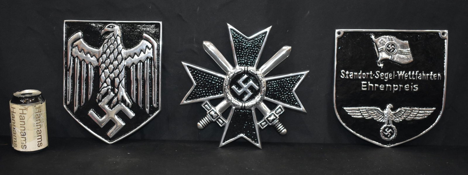 A small metal enamelled German military WW2 plaques together with two other military plaques 24 x 23 (1 of 5)