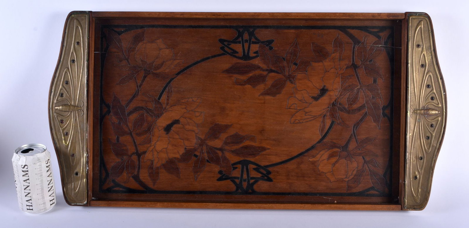 A LARGE FRENCH ART NOUVEAU BRASS AND GEM MOUNTED WOOD TRAY decorated with scrolling organic foliage,: A LARGE FRENCH ART NOUVEAU BRASS AND GEM MOUNTED WOOD TRAY decorated with scrolling organic foliage, the handles formed with dragonflies. 72 cm x 35 cm.
