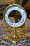 AN ANTIQUE ORMOLU BAROMETER ON STAND formed with opposing birds. 27 cm x 14 cm.