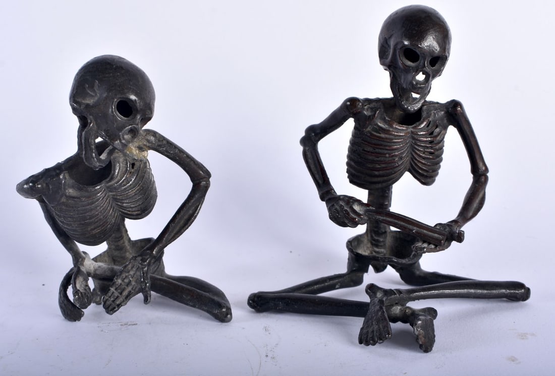 TWO RARE 19TH CENTURY JAPANESE MEIJI PERIOD BRONZE OKIMONO modelled as skeletons. Largest 11 cm x 8: TWO RARE 19TH CENTURY JAPANESE MEIJI PERIOD BRONZE OKIMONO modelled as skeletons. Largest 11 cm x 8 cm. (2)