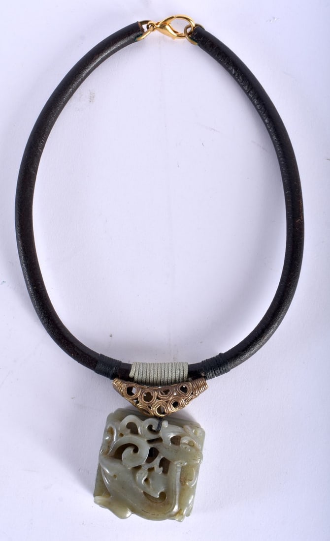 A 17TH/18TH CENTURY CHINESE CARVED JADE PENDANT Ming/Qing, formed on a later gilt reticulated neckla (1 of 4)