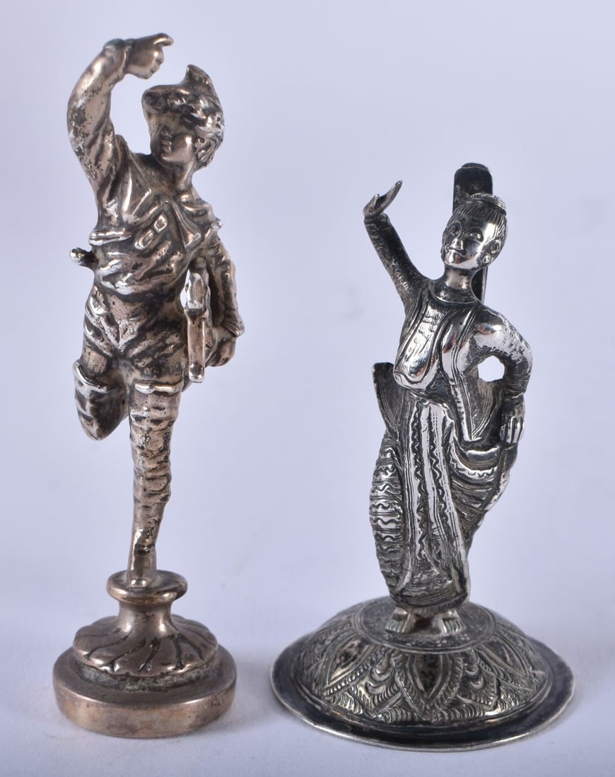 A Menu Card Holder in the form of a Silver Model of a Thai Dancer together with another Silver Figur (1 of 4)