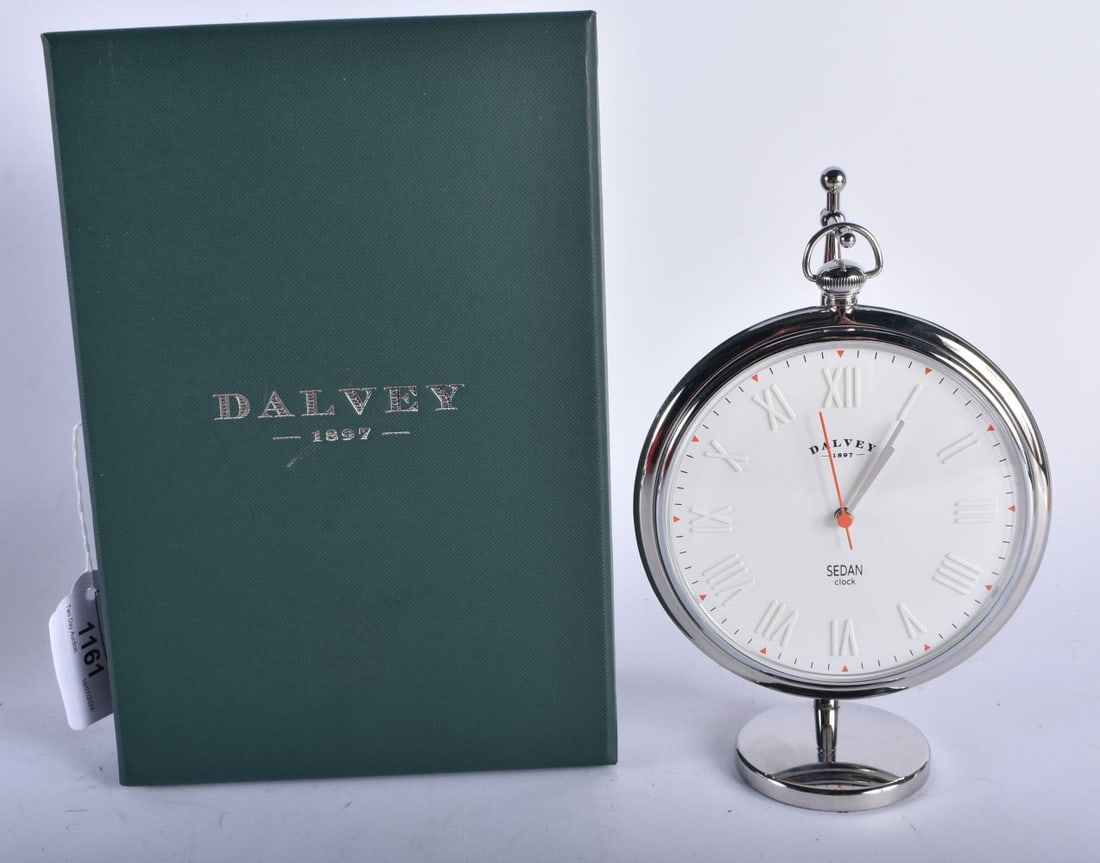 A Boxed (as new) Dalvey of Scotland Sedan Clock. Height (on stand) 18cm, Dial 10.5cm. Working: A Boxed (as new) Dalvey of Scotland Sedan Clock. Height (on stand) 18cm, Dial 10.5cm. Working