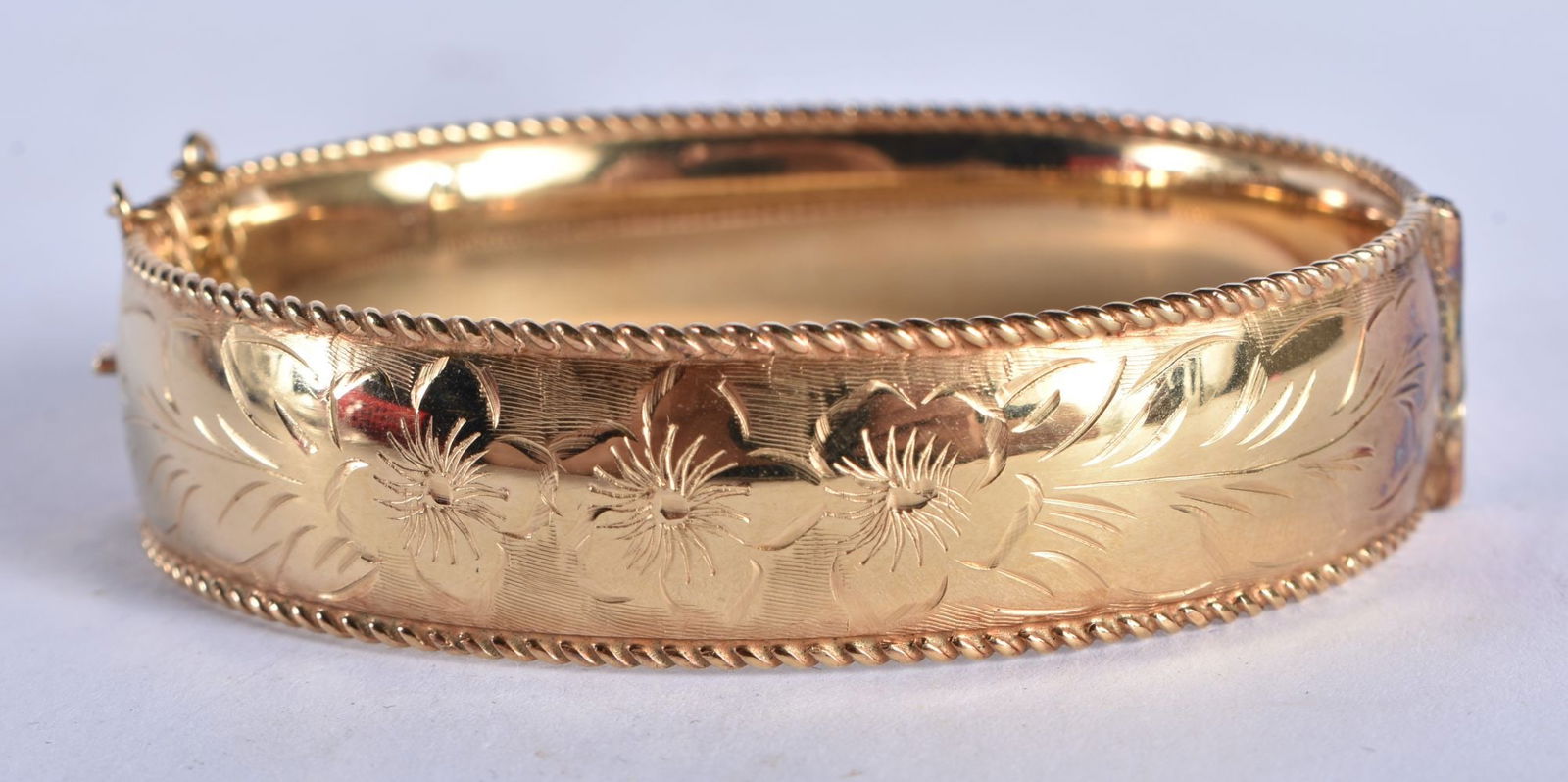 A 9 Carat Rolled Gold Bangle with Etched Floral Design.  Stamped 1/5TH 9CT RG.  Internal 6cm x 5.4cm (1 of 5)