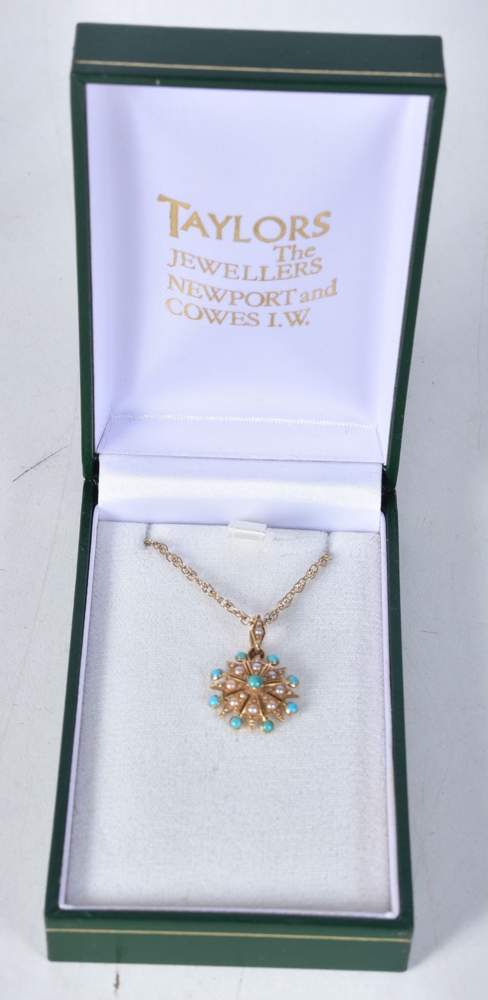 An 18 Carat Pendant Necklace. Pendant set with Turquoise and Pearl. Stamped 18K. Chain 46cm, Pend: An 18 Carat Pendant Necklace. Pendant set with Turquoise and Pearl. Stamped 18K. Chain 46cm, Pendant 2.3cm x 1.7cm, total weight 4.1g