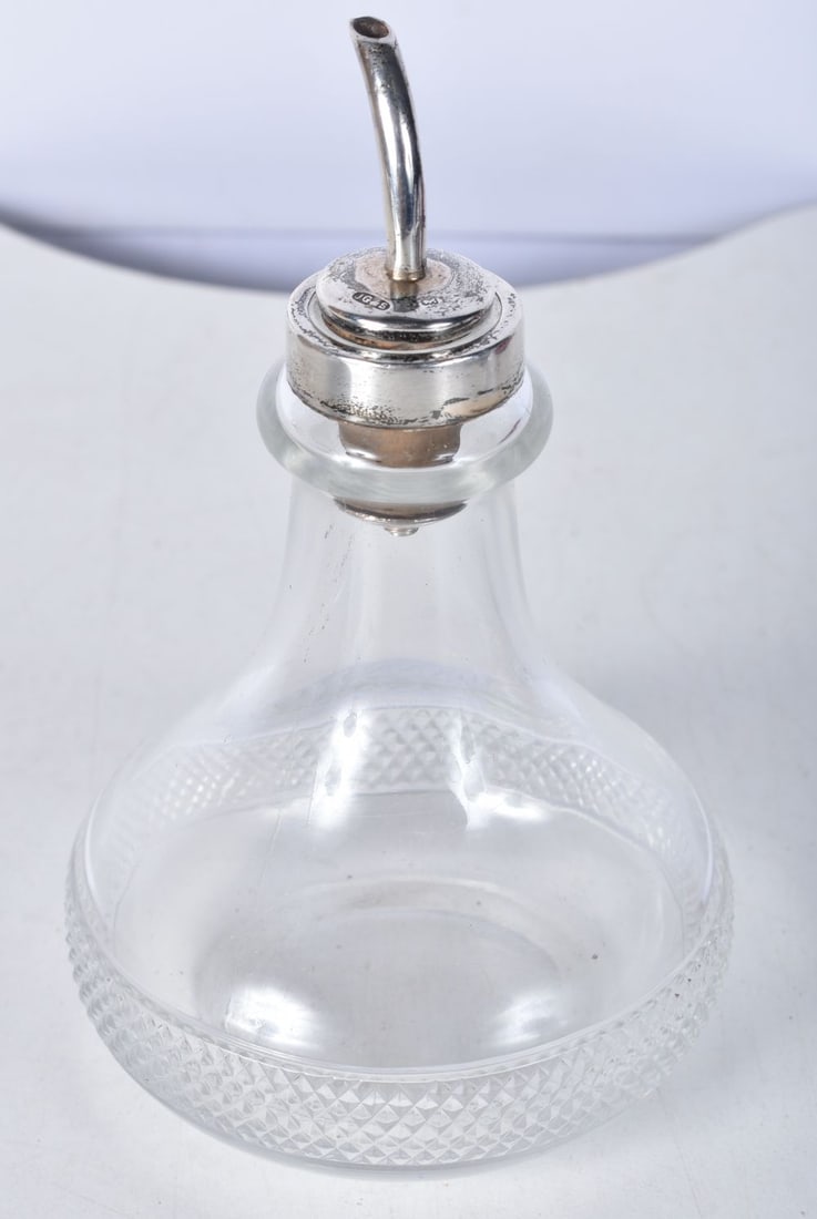 A Silver Topped Oil Bottle by James Dixon and Sons. Hallmarked Birmingham 1859. 13.3cm x 8.4cm: A Silver Topped Oil Bottle by James Dixon and Sons. Hallmarked Birmingham 1859. 13.3cm x 8.4cm