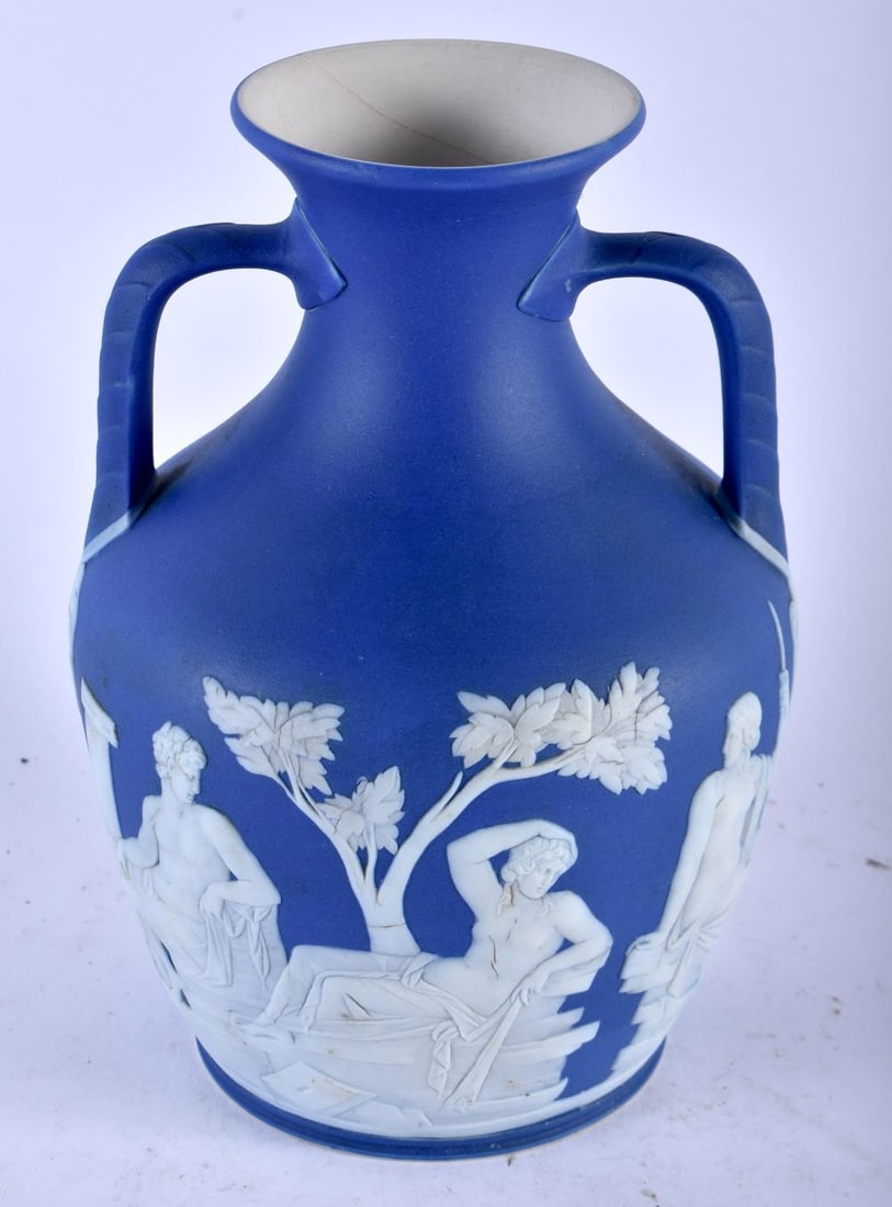 A RARE ANTIQUE WEDGWOOD BLUE JASPERWARE TWIN HANDLED PORTLAND VASE decorated with classical figures. (1 of 4)