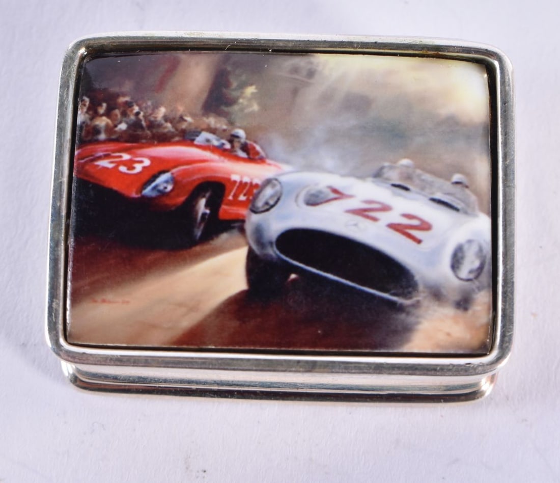 A Silver Pill Box with a Racing Car Lid. Stamped Sterling. 3.2 cm x 2.6 cm x 1.2 cm, weight 20.8g: A Silver Pill Box with a Racing Car Lid. Stamped Sterling. 3.2 cm x 2.6 cm x 1.2 cm, weight 20.8g
