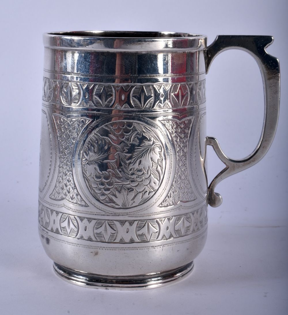 A Victorian Silver Christening Mug.  Hallmarked Birmingham 1873.  9cm x 9.5cm x 8.8cm, weight 146g (1 of 4)