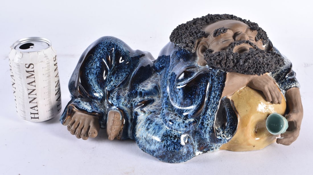 A LARGE EARLY 20TH CENTURY CHINESE SHIWAN POTTERY FIGURE OF A DRUNKEN MALE modelled holding a cup. 3 (1 of 6)