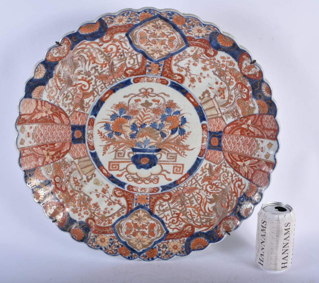 A LARGE 19TH CENTURY JAPANESE MEIJI PERIOD IMARI SCALLOPED CHARGER painted with flowers. 45 cm wide.: A LARGE 19TH CENTURY JAPANESE MEIJI PERIOD IMARI SCALLOPED CHARGER painted with flowers. 45 cm wide.