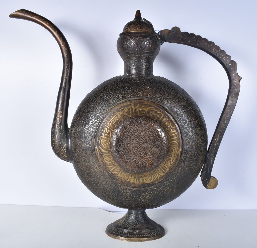 A large Islamic bronze Ewer embossed with Calligraphy and foliage 60 cm. (1 of 4)