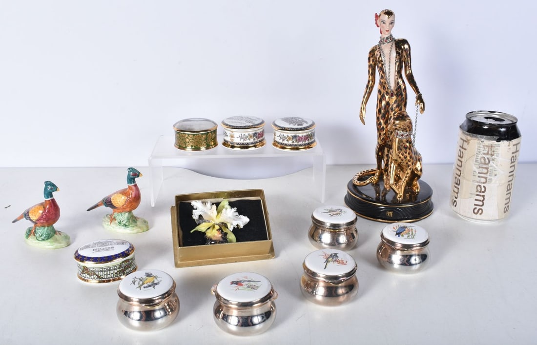 An Art Deco style ETRE figure of a female and a leopard together with two ceramic pheasants, a crown: An Art Deco style ETRE figure of a female and a leopard together with two ceramic pheasants, a crown Derby ceramic broach and a collection of ceramic pill boxes 23 cm
