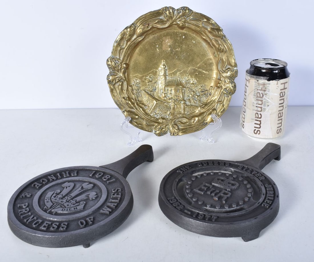Two vintage cast iron Trivets marking Royal jubilees together with a heavy brass dish 21 x 13.5cm (: Two vintage cast iron Trivets marking Royal jubilees together with a heavy brass dish 21 x 13.5cm (3)