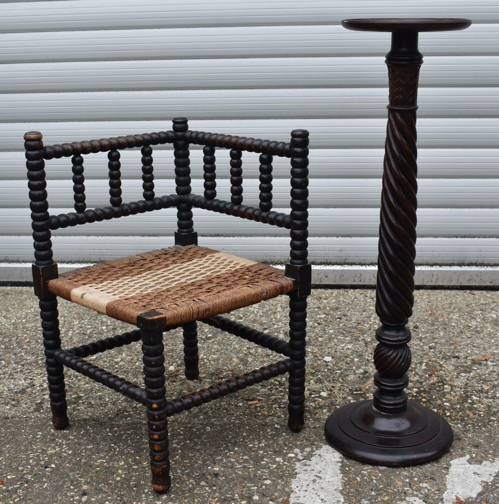 A wooden bobble corner chair with a woven seat together with a wooden plant stand 87cm (2).: A wooden bobble corner chair with a woven seat together with a wooden plant stand 87cm (2).