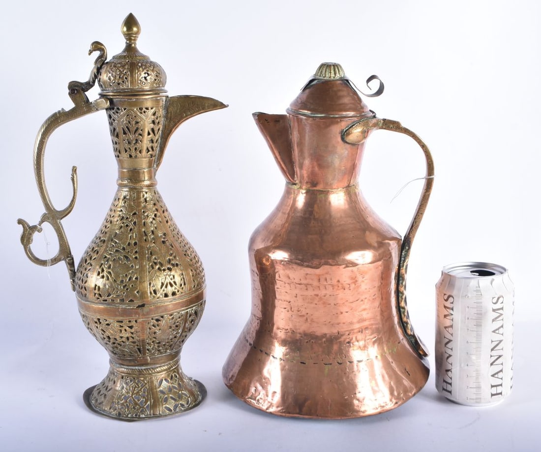 AN 18TH/19TH CENTURY ISLAMIC MIDDLE EASTERN RETICULATED BRASS EWER together with a copper jug. Large (1 of 6)