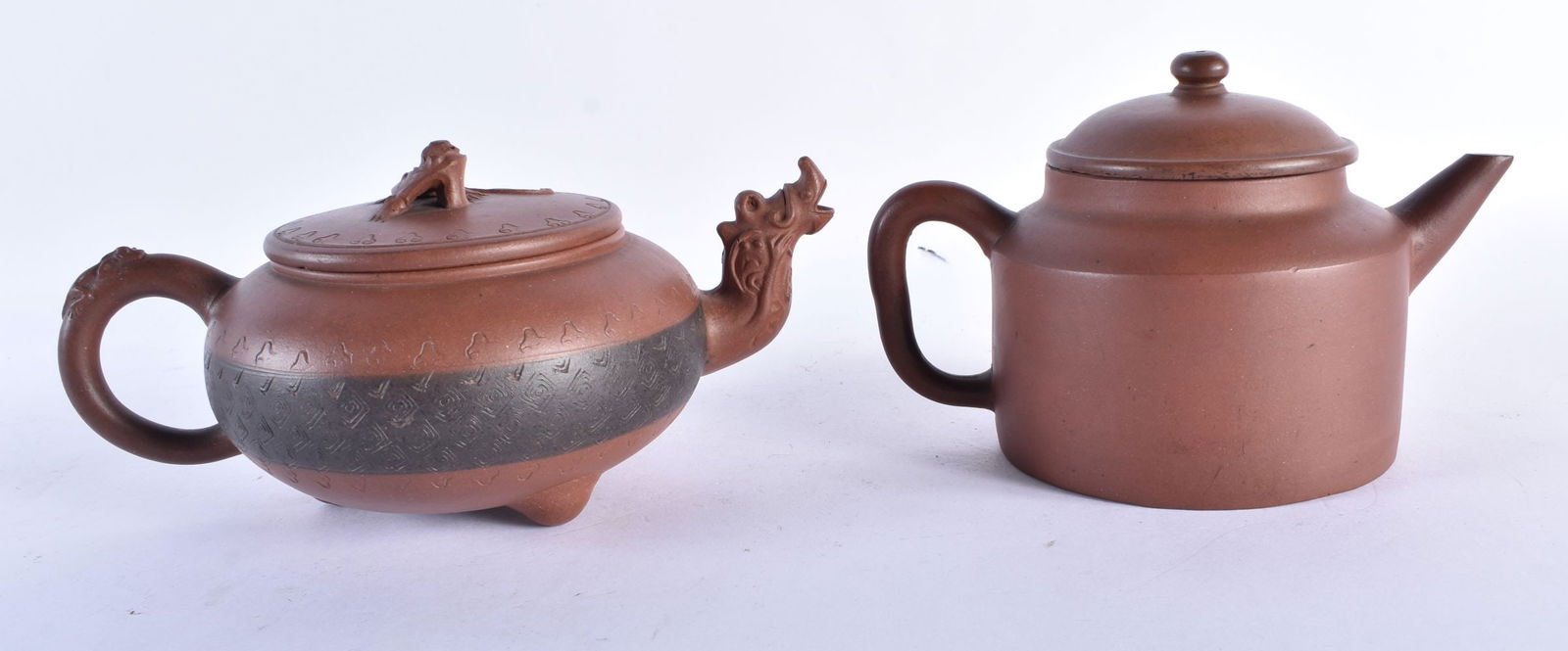 TWO 19TH CENTURY CHINESE YIXING POTTERY TEAPOTS AND COVERS. Largest 18 cm wide. (2) (1 of 8)