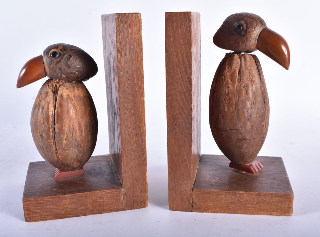 A RARE PAIR OF ART DECO CARVED COCONUT AND BAKELITE AMBER TYPE BOOKENDS. Each 15 cm x 9 cm. (1 of 5)