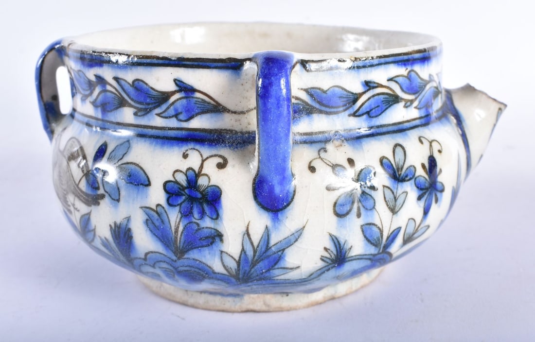 A RARE 18TH CENTURY MIDDLE EASTERN SAFAVID POURING BOWL with three loop handles, painted with birds (1 of 6)