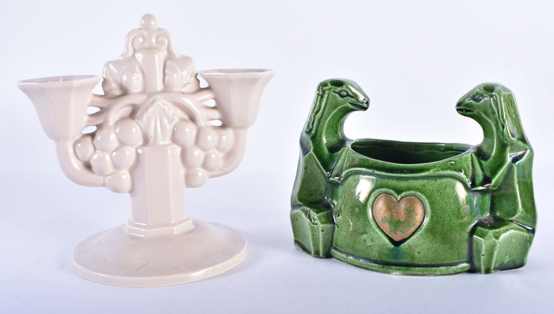 AN ART DECO POOLE POTTERY CANDLESTICK together with a green glazed art deco vessel. Largest 15.5 cm: AN ART DECO POOLE POTTERY CANDLESTICK together with a green glazed art deco vessel. Largest 15.5 cm wide. (2)