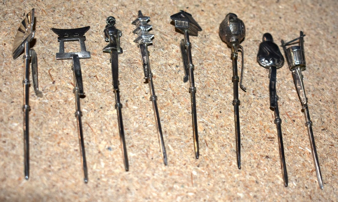 Eight Japanese Silver Toothpicks. Various Designs. Stamped Sterling. Largest 7cm x 0.9cm, total w: Eight Japanese Silver Toothpicks. Various Designs. Stamped Sterling. Largest 7cm x 0.9cm, total weight 21.5g (8)