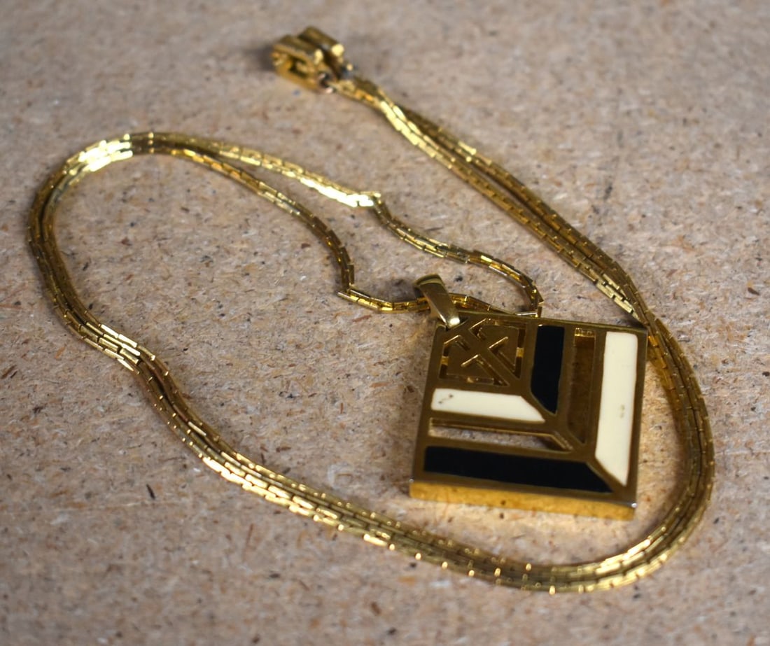 Gold tone enamel pendant necklace by designer Givenchy. Pendant 5cm x 4.3cm, Chain 70cm long, weigh: Gold tone enamel pendant necklace by designer Givenchy. Pendant 5cm x 4.3cm, Chain 70cm long, weight 28.5g