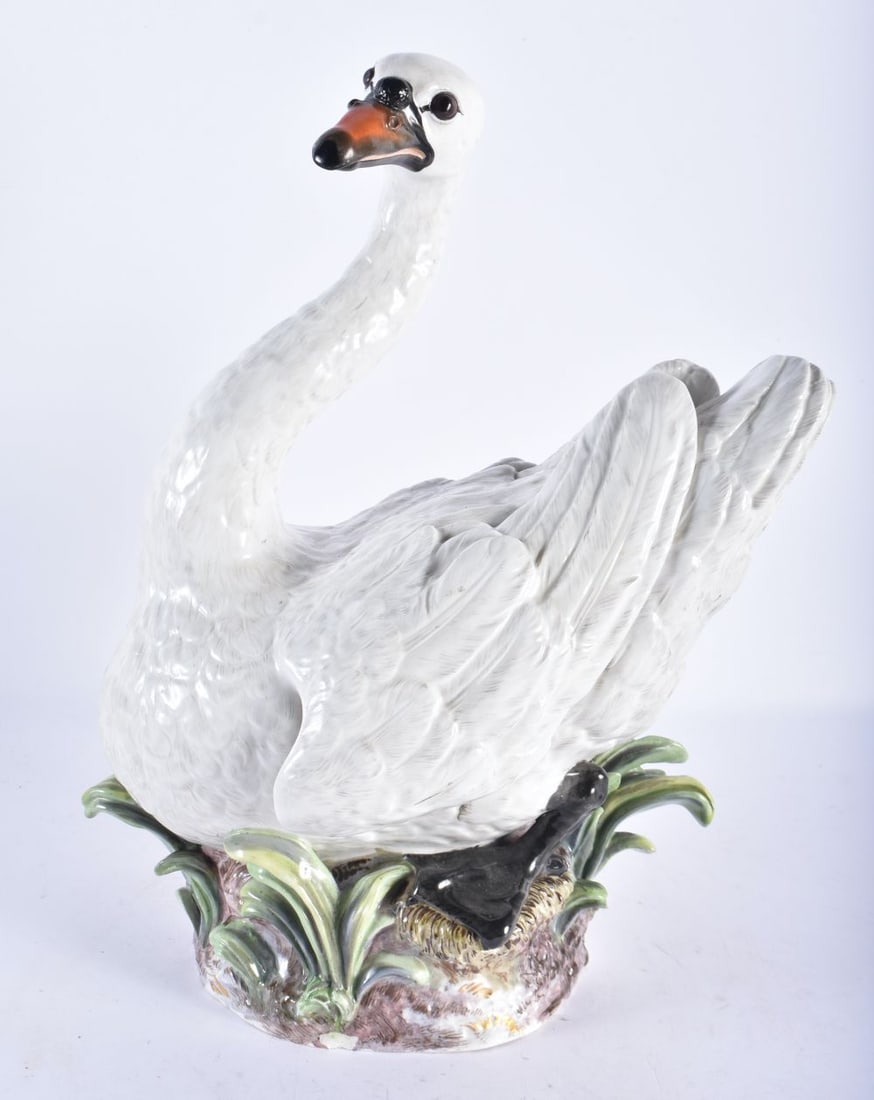 A LARGE 19TH CENTURY MEISSEN PORCELAIN FIGURE OF A SWAN modelled upon a naturalistic base. 33 cm x 2 (1 of 6)