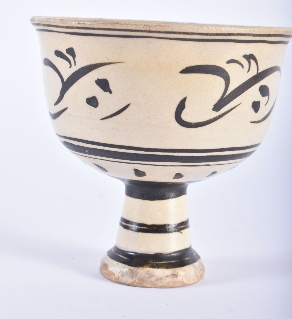 A LOVELY 16TH/17TH CENTURY CHINESE CHIZOU POTTERY STEM CUP Late Ming, painted with scattered floral: A LOVELY 16TH/17TH CENTURY CHINESE CHIZOU POTTERY STEM CUP Late Ming, painted with scattered floral sprays. 10 cm wide.