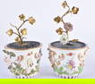 A FINE AND RARE PAIR OF 18TH CENTURY MEISSEN PORCELAIN FLOWER POTS formed with mask heads, with emer