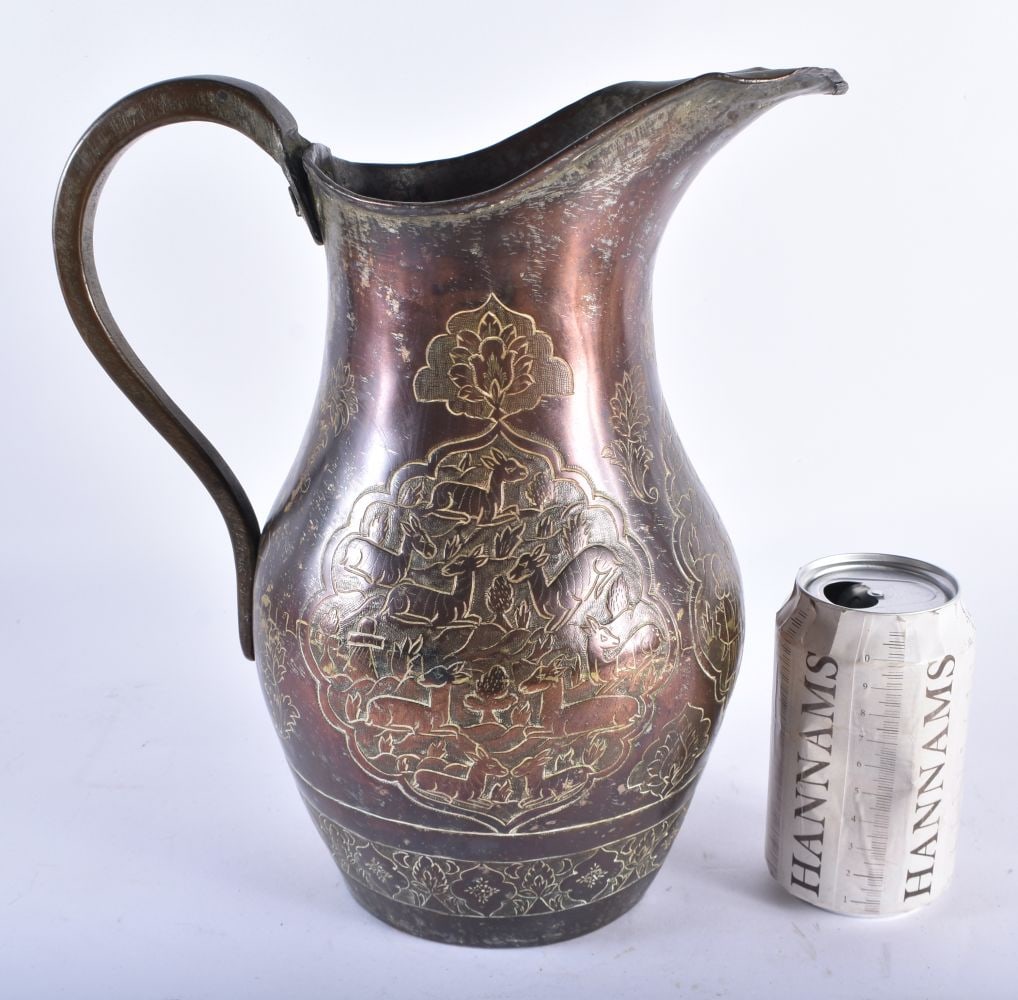 A LARGE 18TH/19TH CENTURY PERSIAN ISLAMIC COPPER ALLOY JUG decorated with deer within landscapes. 30 (1 of 13)