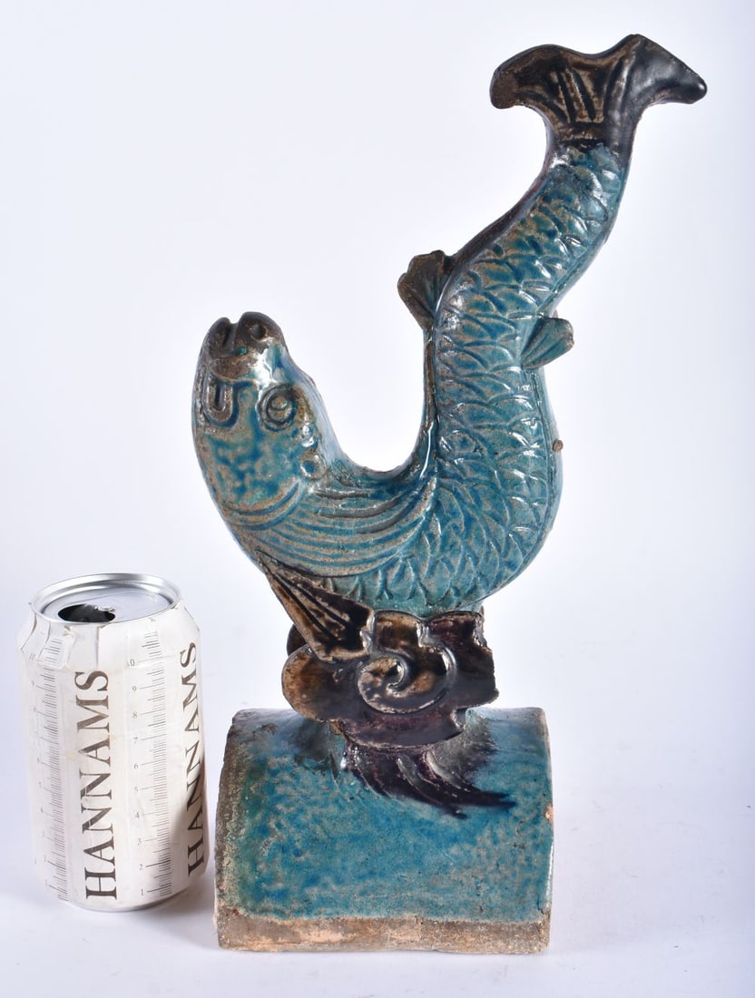 A CHINESE QING DYNASTY FAHUA GLAZED POTTERY ROOF TILE formed with a fish. 32 cm x 14 cm. (1 of 6)