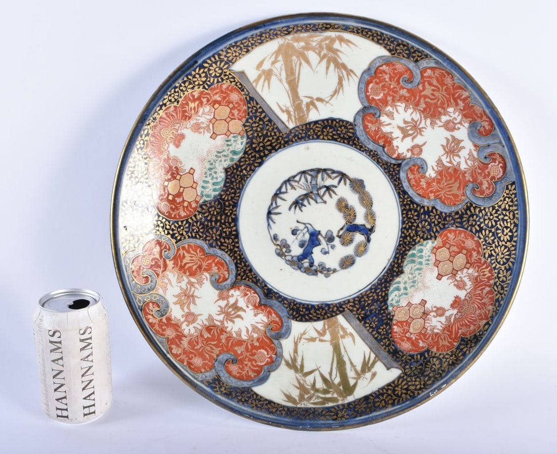 A LARGE 19TH CENTURY JAPANESE MEIJI PERIOD IMARI CHARGER painted with landscapes. 38 cm diameter.: A LARGE 19TH CENTURY JAPANESE MEIJI PERIOD IMARI CHARGER painted with landscapes. 38 cm diameter.